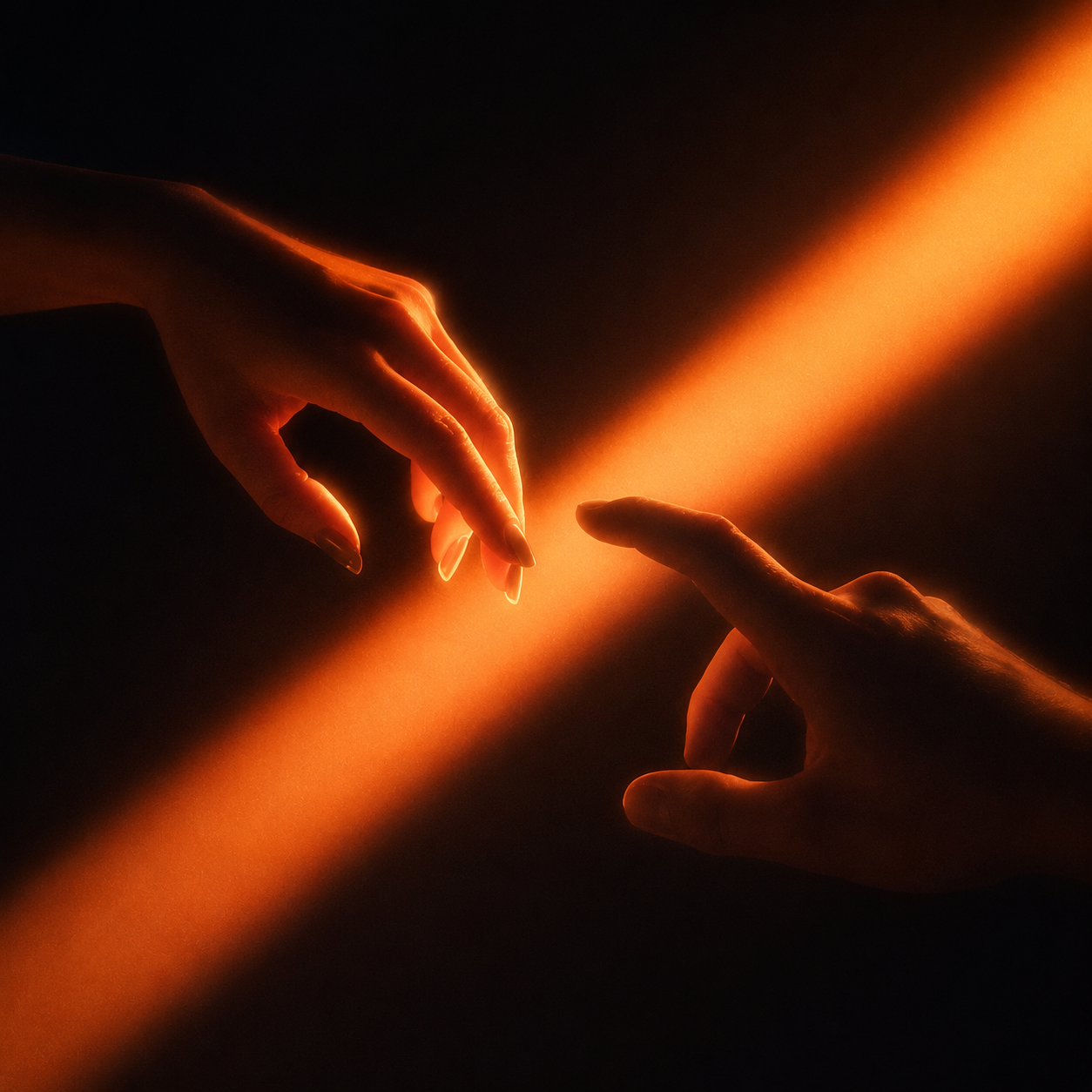 Two hands, not quite touching, against a warm wall.