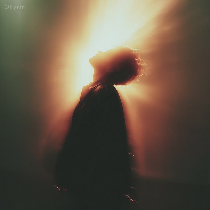 Head tipped back in a burst of late light.